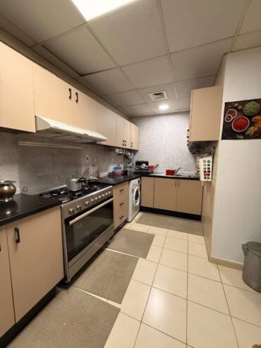 Kitchen cupboards with a refreshed vinyl wrap finish in Dubai